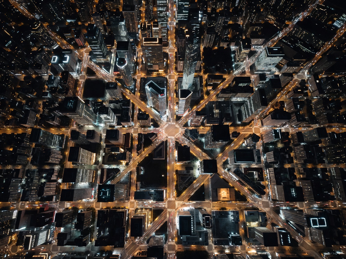 Nighttime aerial view of a modern city grid